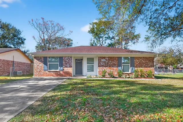 a front view of a house with a yard and porch