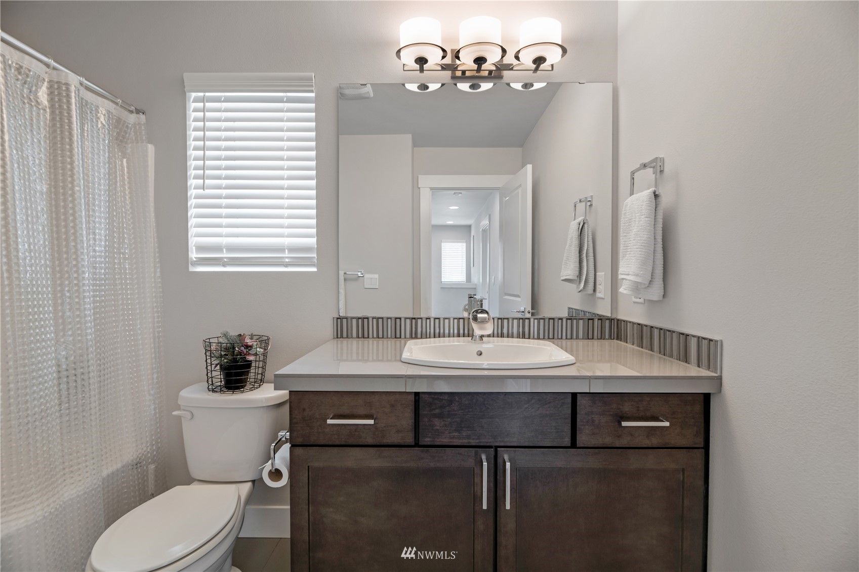 19802 Meridian Place West Bothell, WA 98012 - Photo 26 of 37 a bathroom with a toilet sink and mirror