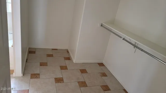 a white bath tub sitting next to a shower