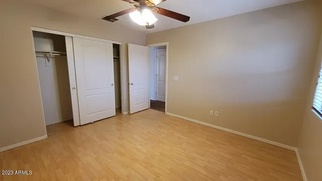 a view of a house with backyard and porch