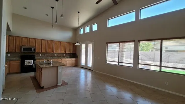 a kitchen with a refrigerator and a sink