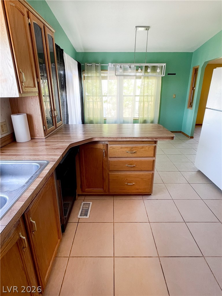 75 West Obsidian Avenue Sandy Valley, NV 89019 - Photo 16 of 23 This bright kitchen features ample counter space and offers a functional layout for daily living.
