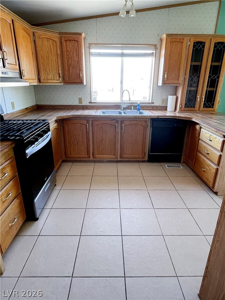 75 West Obsidian Avenue Sandy Valley, NV 89019 - Photo 18 of 23 This spacious kitchen offers ample cabinetry and an inviting atmosphere for culinary endeavors.