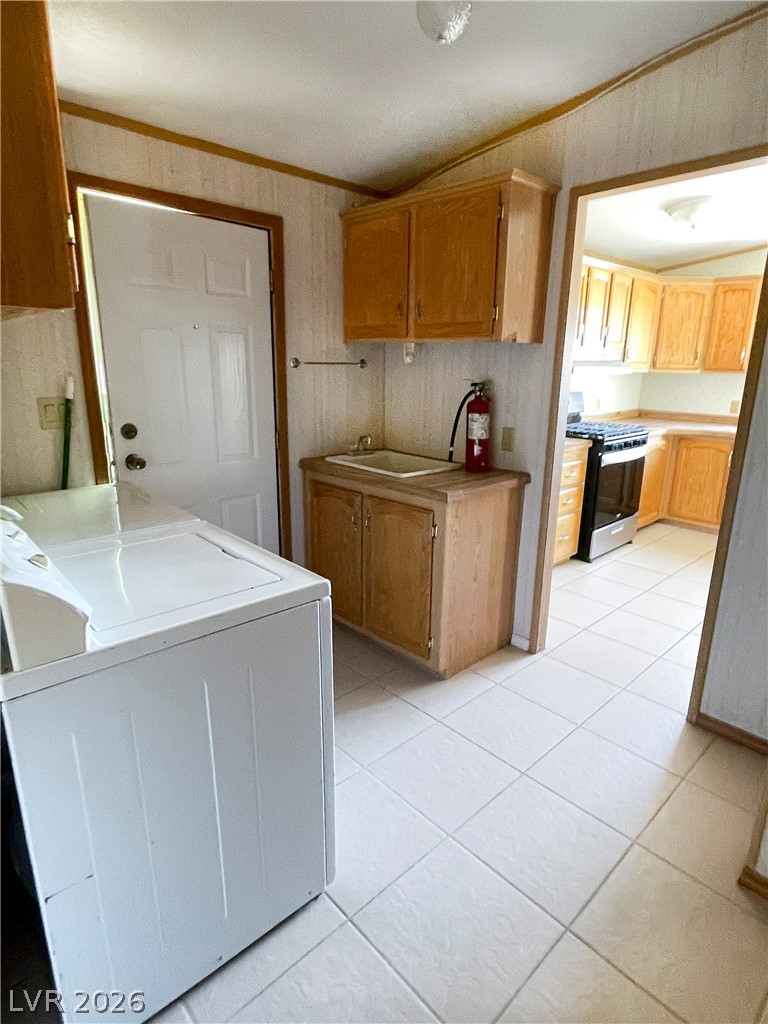 75 West Obsidian Avenue Sandy Valley, NV 89019 - Photo 20 of 23 This functional laundry area features ample cabinetry and a convenient utility sink.