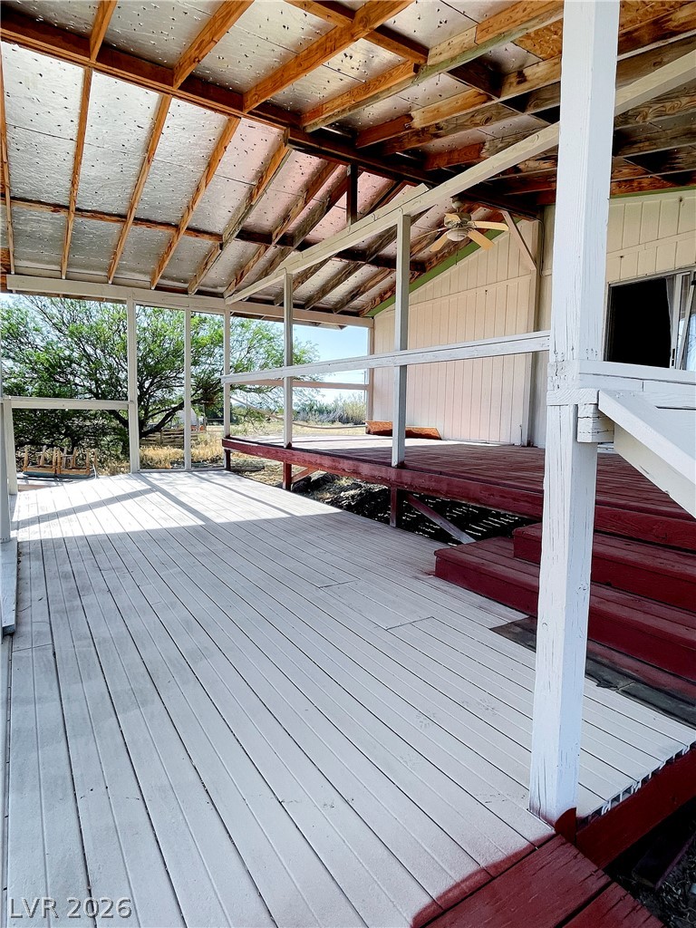 75 West Obsidian Avenue Sandy Valley, NV 89019 - Photo 21 of 23 Enjoy outdoor living on this expansive porch, offering a seamless blend of comfort and nature.