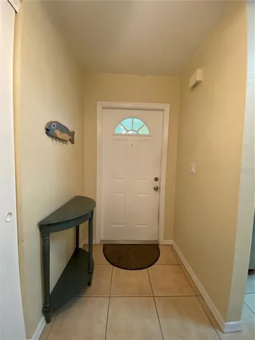 a view of a hallway with seating area