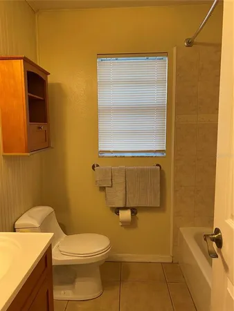 a bathroom with a toilet and a sink