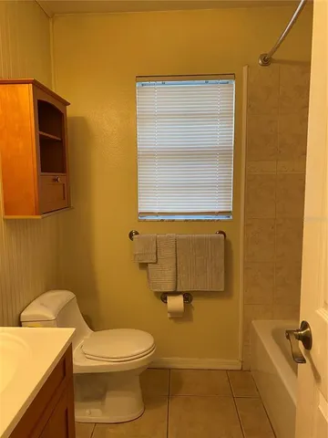 a bathroom with a toilet and a sink
