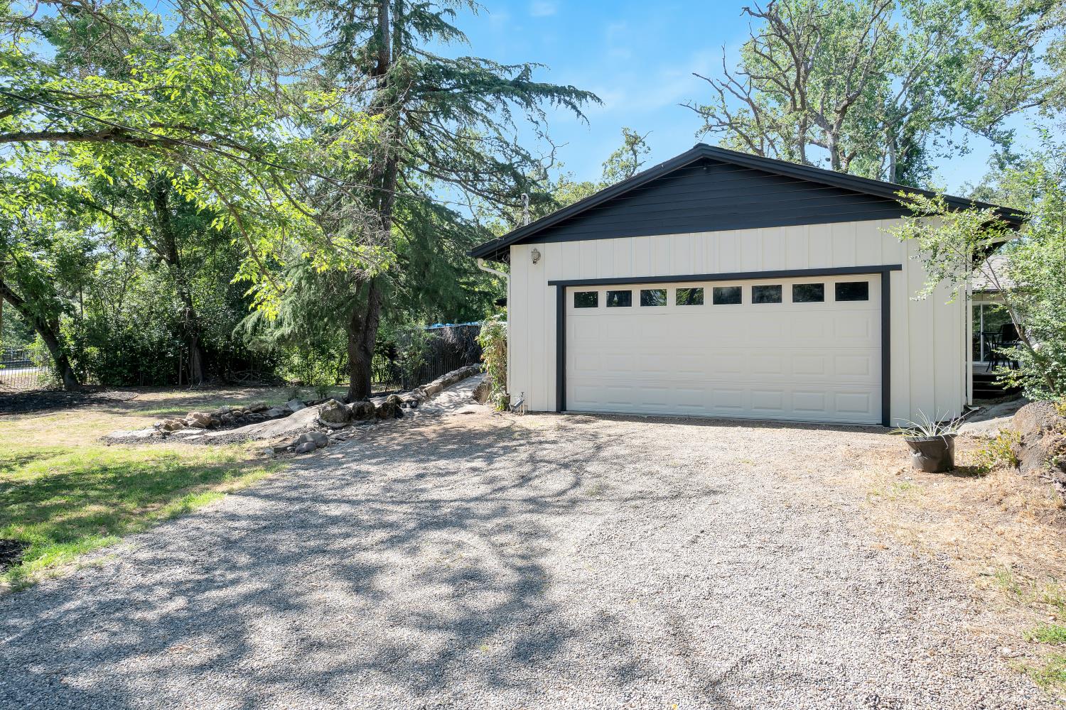 6299 Horseshoe Bar Road Loomis, CA 95650 - Photo 36 of 43 a front view of a house with a yard and garage