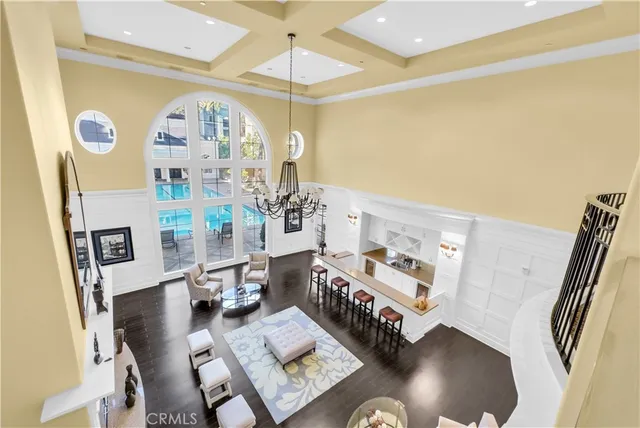 a living room with fireplace furniture and a chandelier