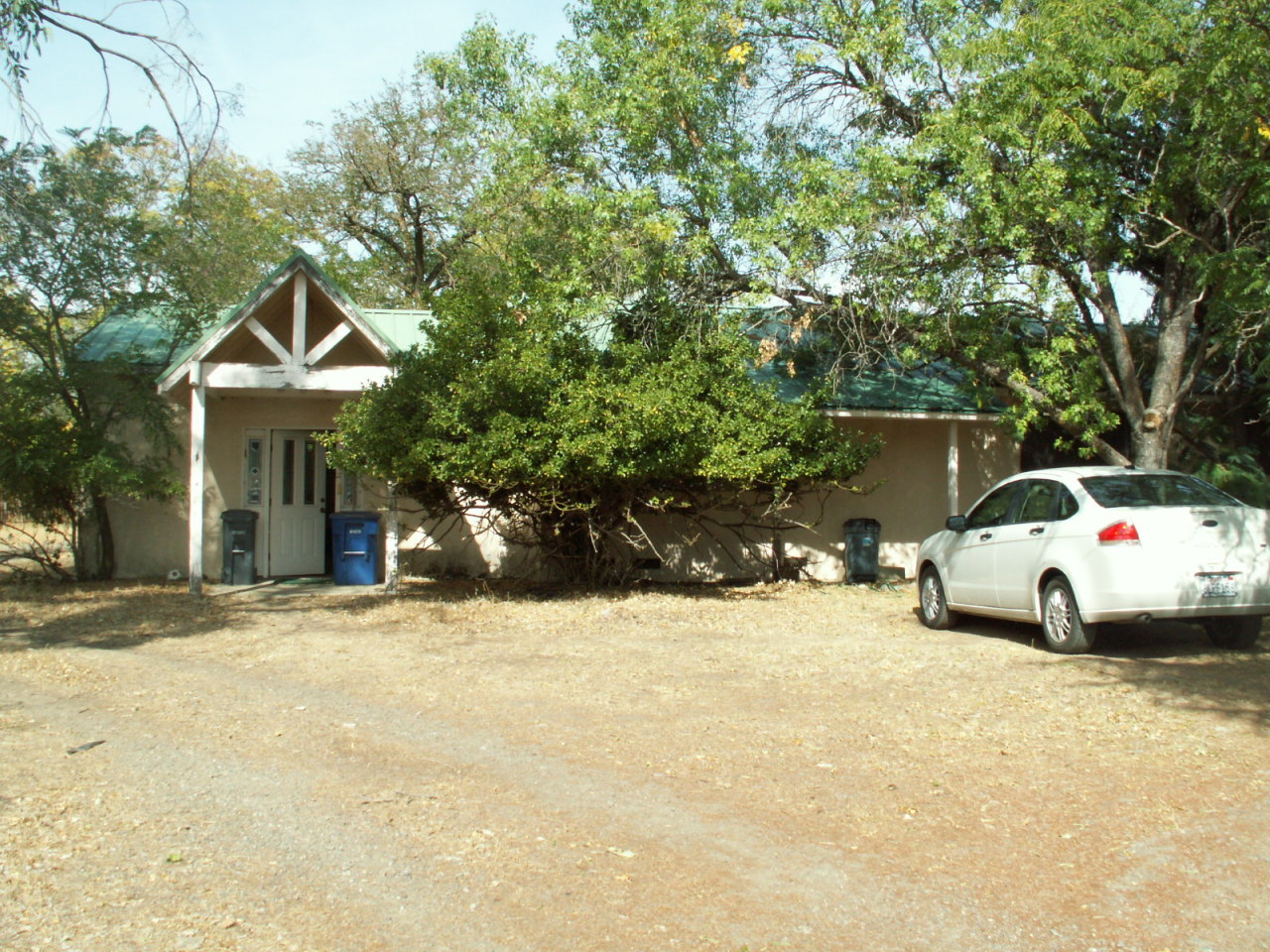 17720 Bowman Road Cottonwood, CA 96022 - Photo 1 of 13 a view of a white house and a large tree in front of it
