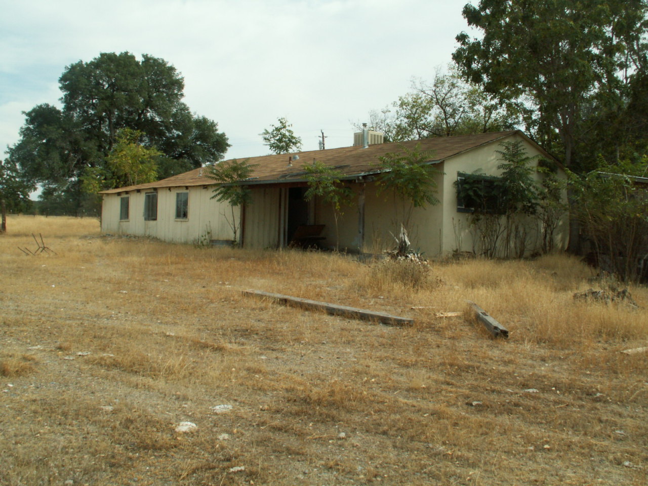 17720 Bowman Road Cottonwood, CA 96022 - Photo 11 of 13 a view of a house with a yard