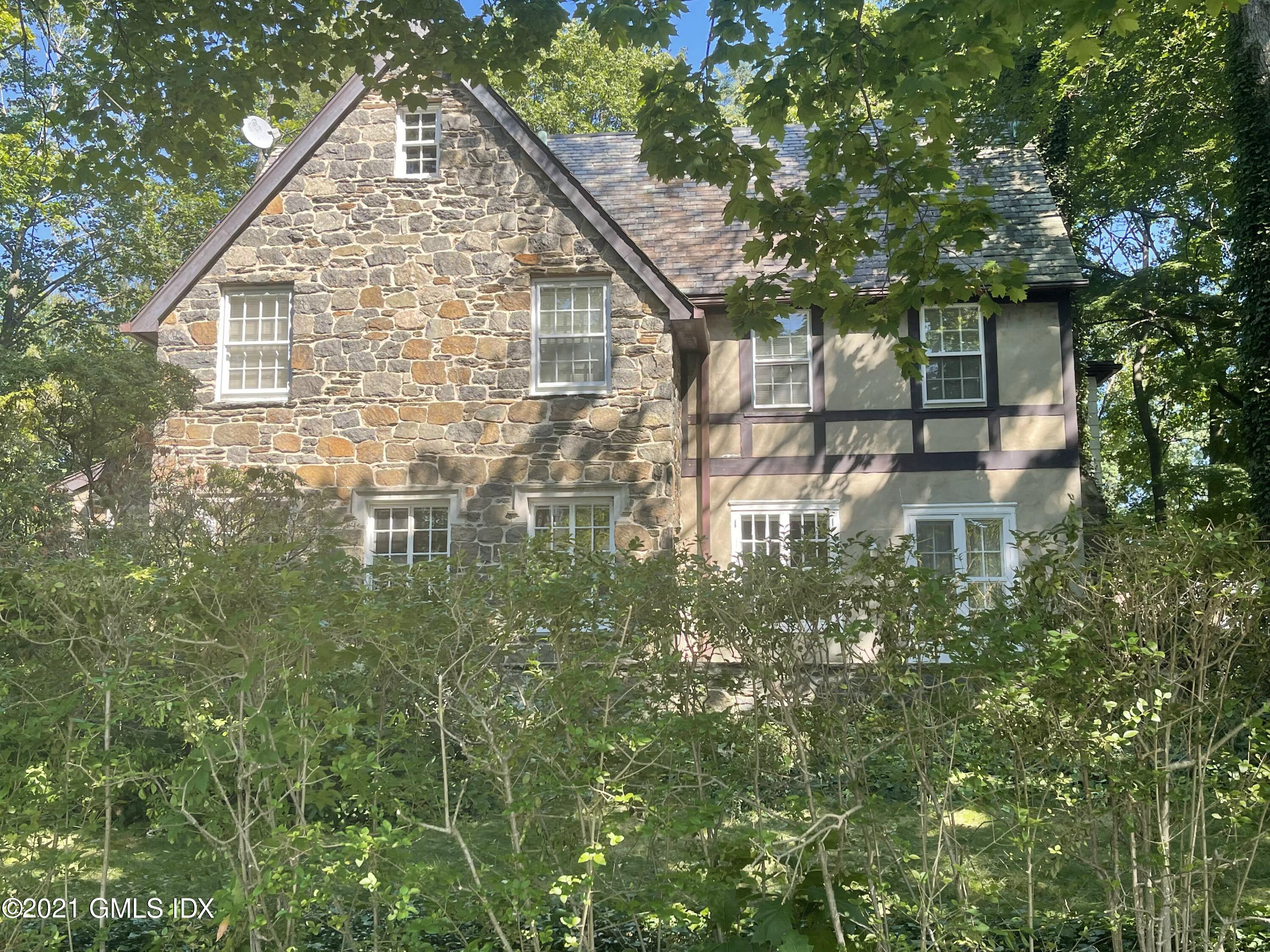 39 Old Church Road Greenwich, CT 06830 - Photo 4 of 4 a backyard of a house with lots of green space