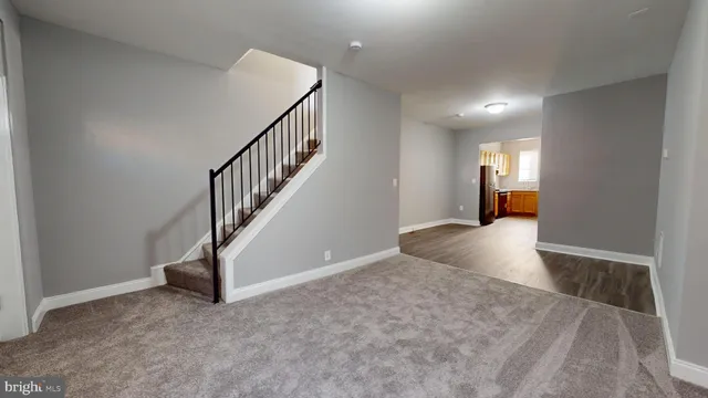 a view of a hallway view with staircase