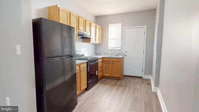 a kitchen with a refrigerator a sink and dishwasher
