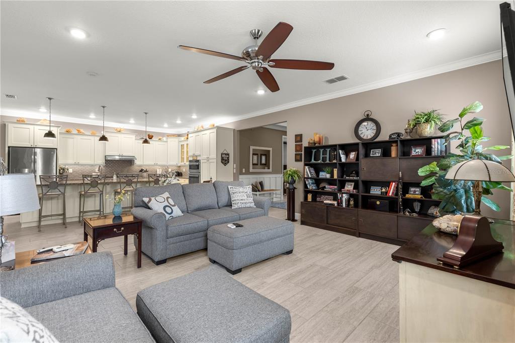9099 Southwest 89th Loop Ocala, FL 34481 - Photo 13 of 66 a living room with furniture and wooden floor