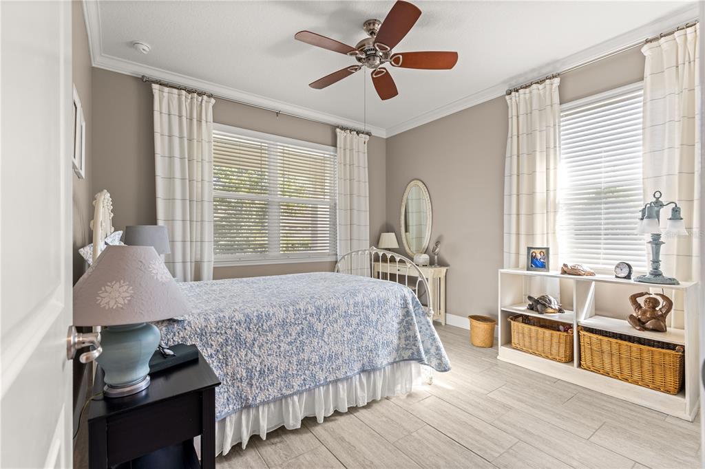 9099 Southwest 89th Loop Ocala, FL 34481 - Photo 30 of 66 a bedroom with furniture and a large window