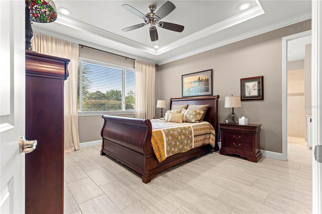 9099 Southwest 89th Loop Ocala, FL 34481 - Photo 33 of 66 a bedroom with a bed and window