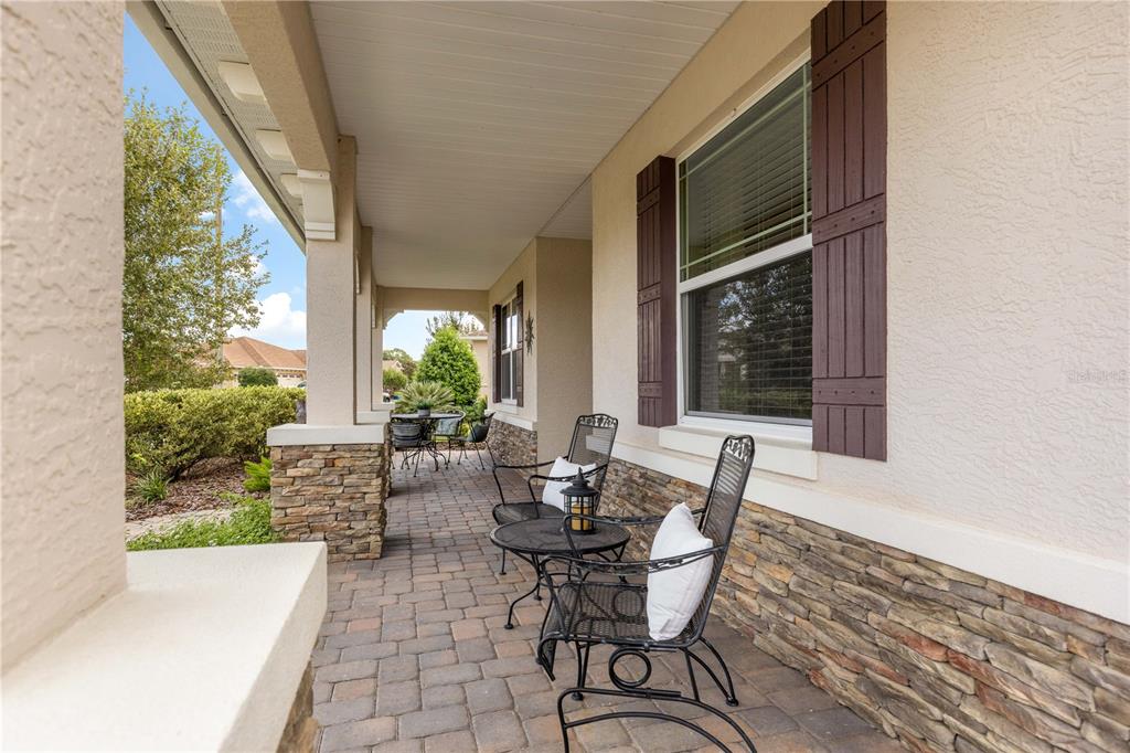 9099 Southwest 89th Loop Ocala, FL 34481 - Photo 4 of 66 a view of a patio with table and chairs