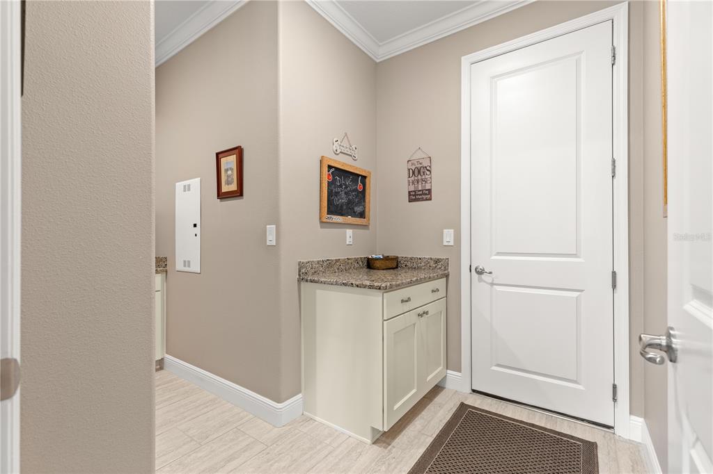 9099 Southwest 89th Loop Ocala, FL 34481 - Photo 44 of 66 a view of a kitchen with stainless steel appliances granite countertop and a refrigerator