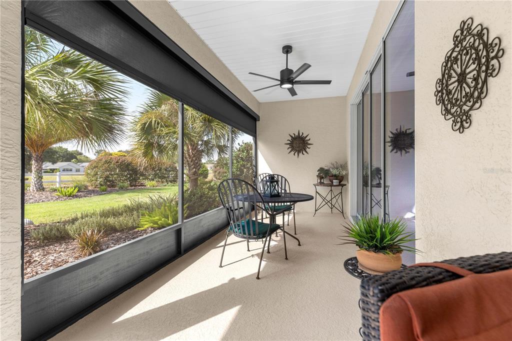 9099 Southwest 89th Loop Ocala, FL 34481 - Photo 50 of 66 a view of a porch with furniture and a yard