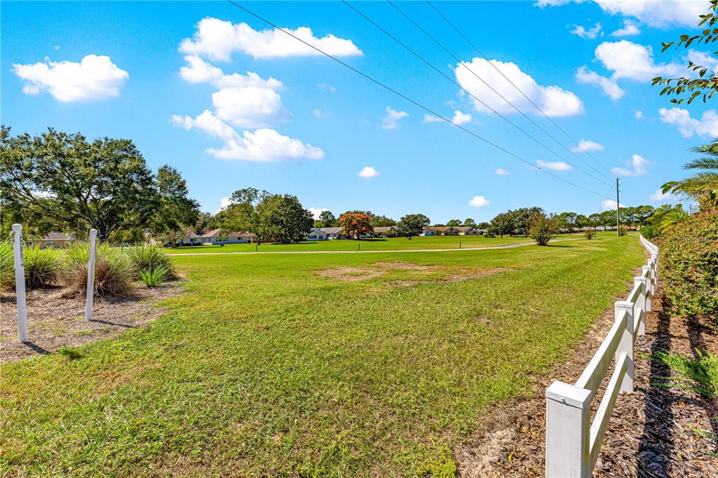 9099 Southwest 89th Loop Ocala, FL 34481 - Photo 59 of 66 a view of a lake with a big yard