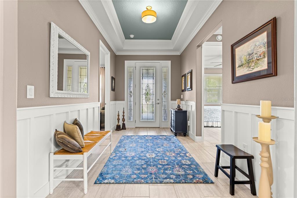 9099 Southwest 89th Loop Ocala, FL 34481 - Photo 8 of 66 a living room with furniture and a rug