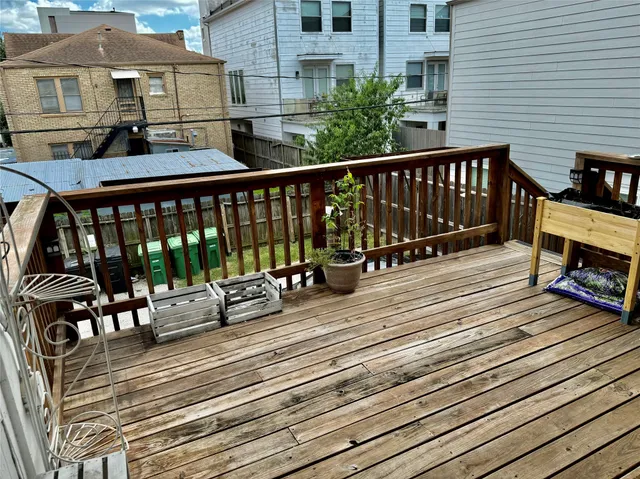 a view of a wooden deck with a bench