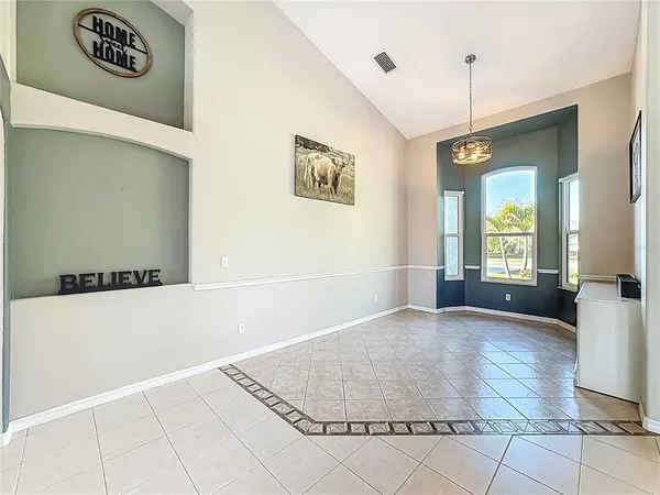 a kitchen with stainless steel appliances granite countertop a stove and a sink