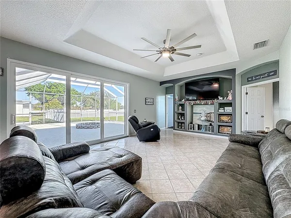 a bedroom with a bed and a television