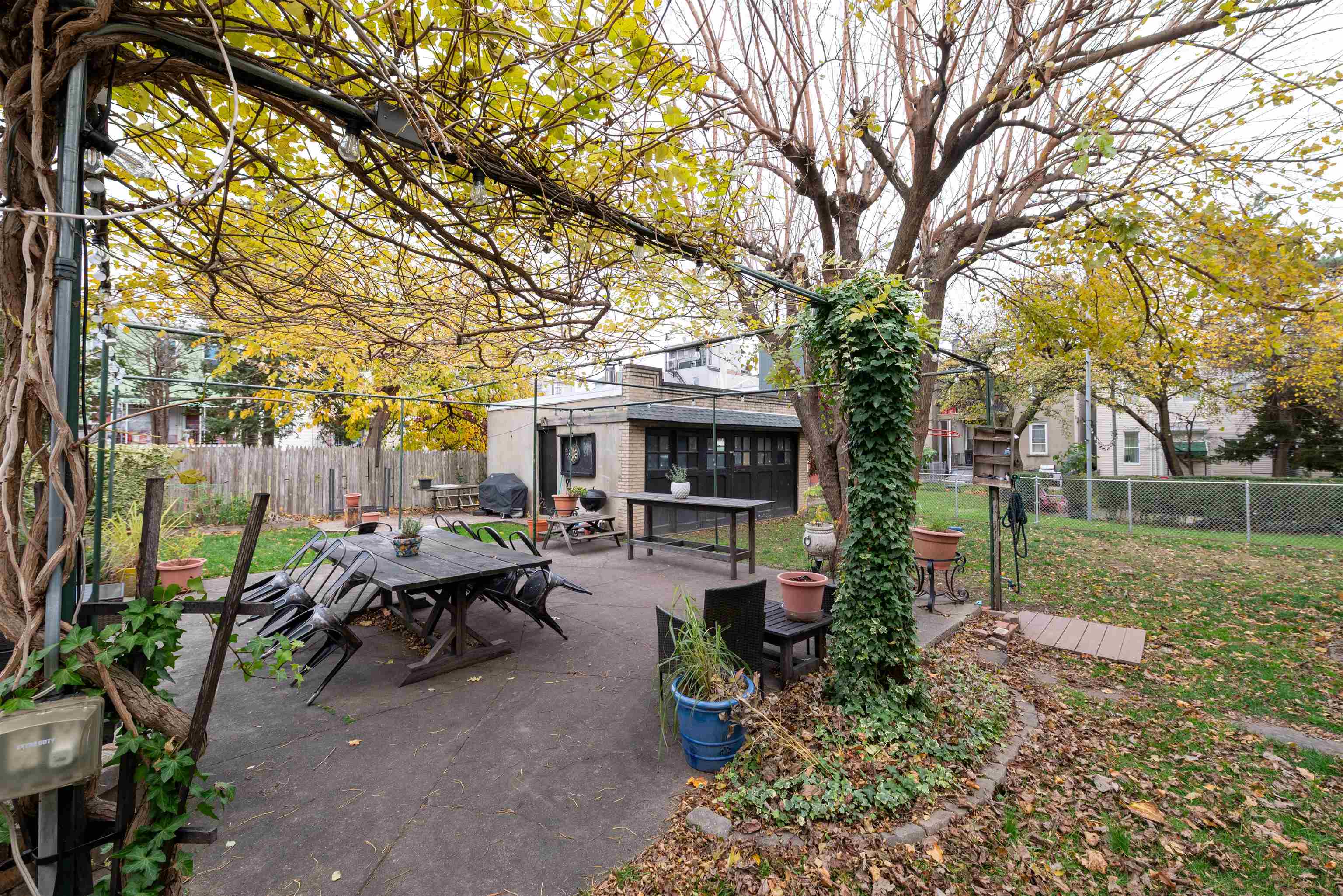 312 Monastery Place, Unit 3R Union City, NJ 07087 - Photo 15 of 16 a view of a patio with chair and table and chairs under an umbrella