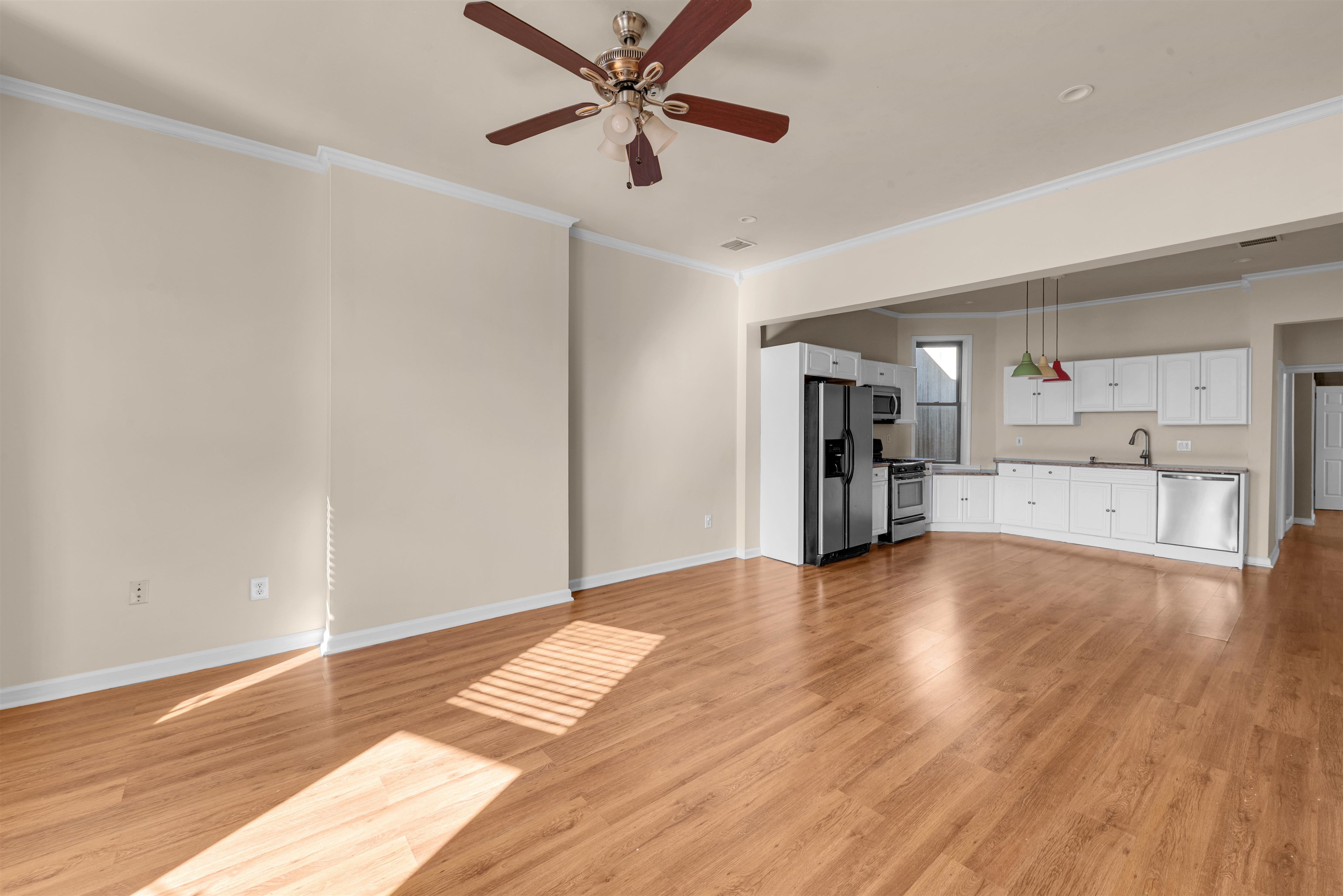 312 Monastery Place, Unit 3R Union City, NJ 07087 - Photo 2 of 16 a view of empty room with wooden floor and window