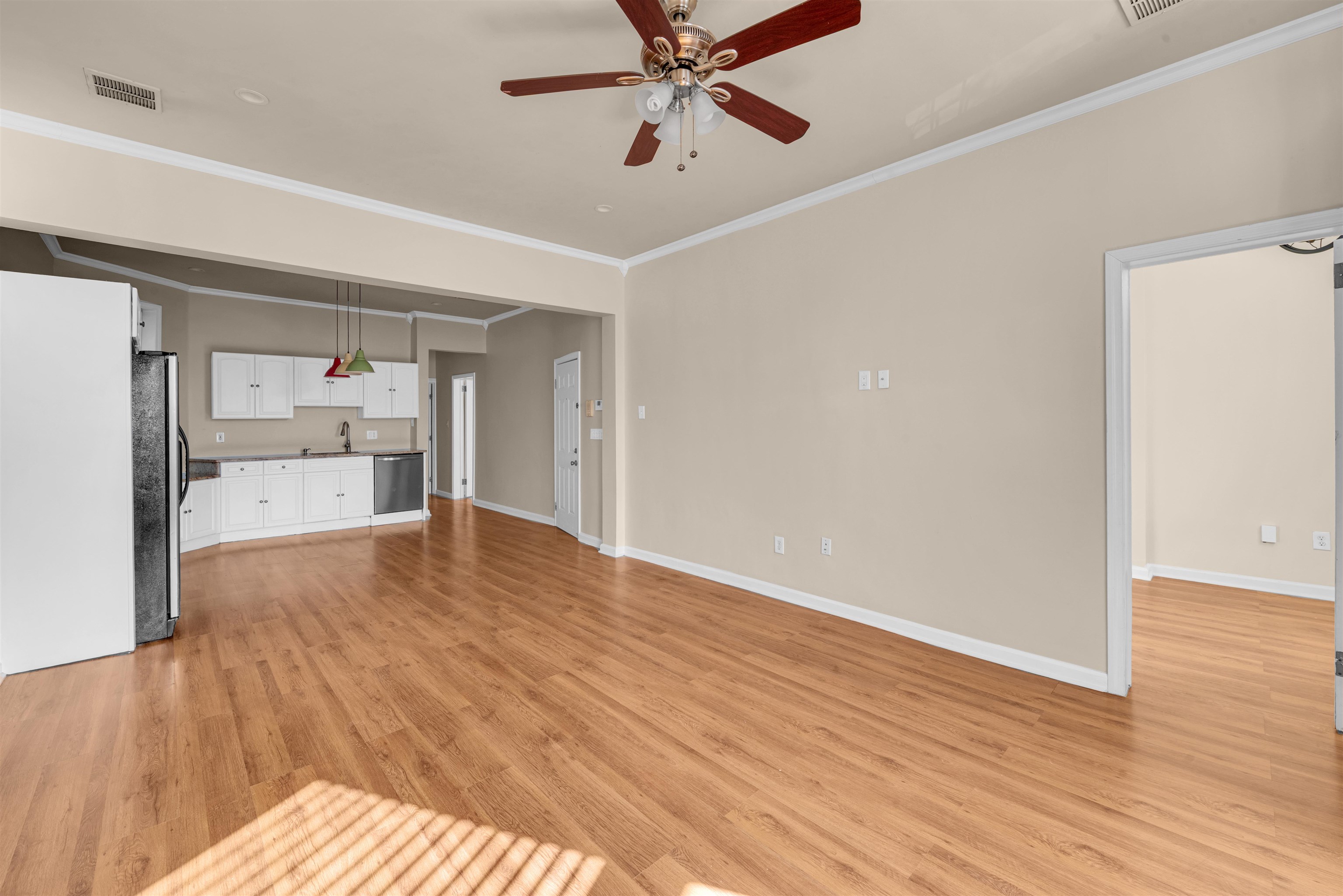 312 Monastery Place, Unit 3R Union City, NJ 07087 - Photo 3 of 16 a view of a room with wooden floor and a ceiling fan