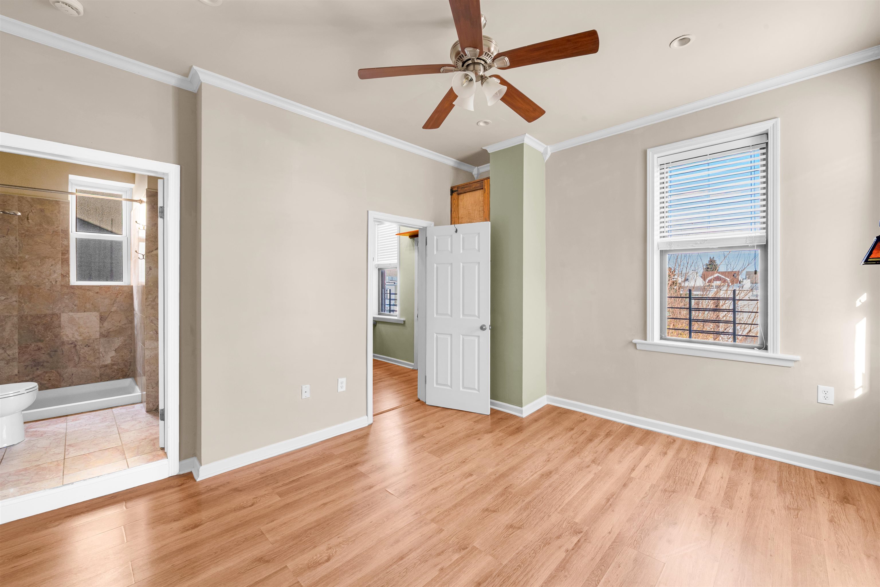 312 Monastery Place, Unit 3R Union City, NJ 07087 - Photo 4 of 16 a view of an empty room with window and wooden floor