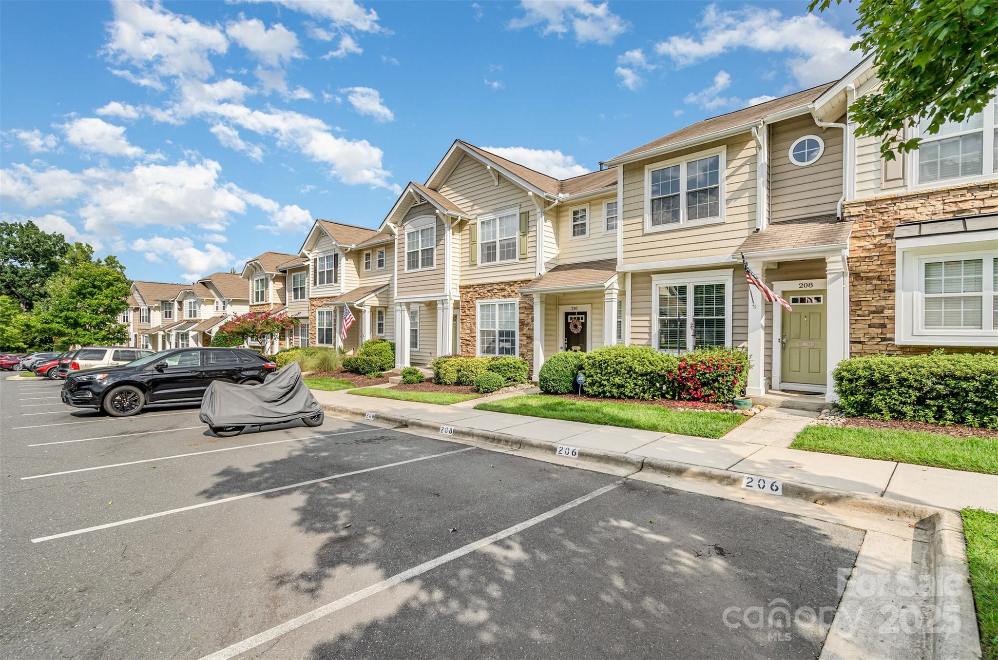 208 Dawn Mist Lane Fort Mill, SC 29708 - Photo 2 of 30 a view of a parked cars in front of a building