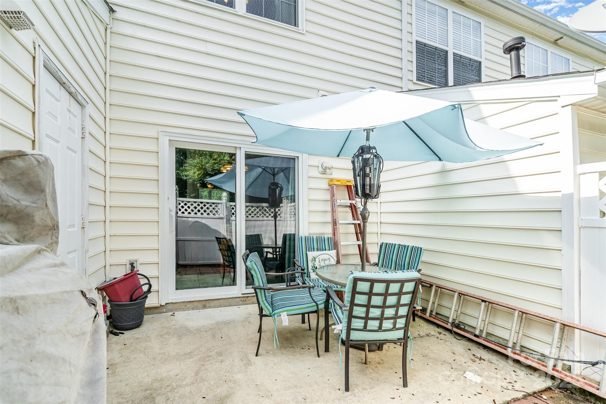 208 Dawn Mist Lane Fort Mill, SC 29708 - Photo 22 of 30 a view of a patio with a table and chairs and a barbeque
