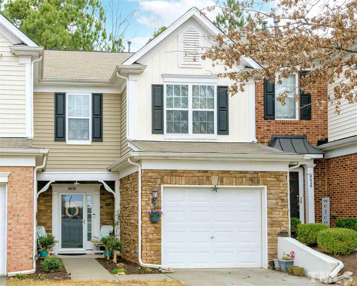 8630 Redcrest Place Raleigh, NC 27617 - Photo 1 of 24 a front view of a house with a garage