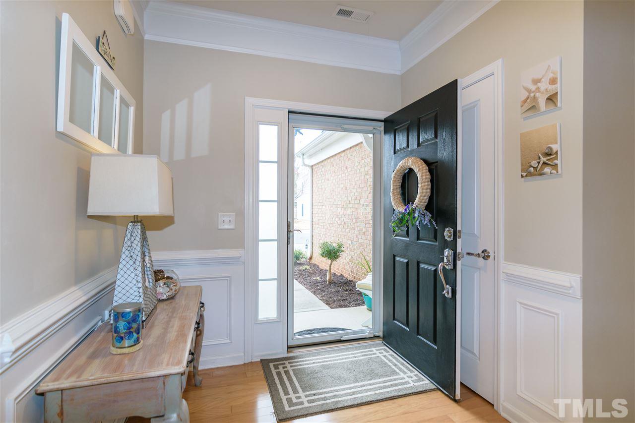 8630 Redcrest Place Raleigh, NC 27617 - Photo 2 of 24 a living room with furniture and a window