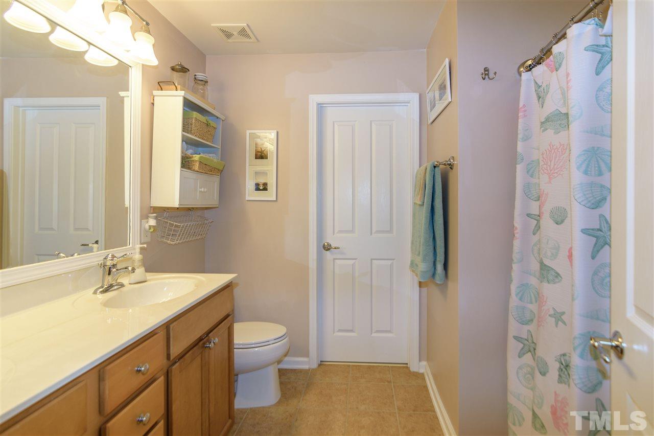 8630 Redcrest Place Raleigh, NC 27617 - Photo 15 of 24 a bathroom with a double vanity sink toilet and shower