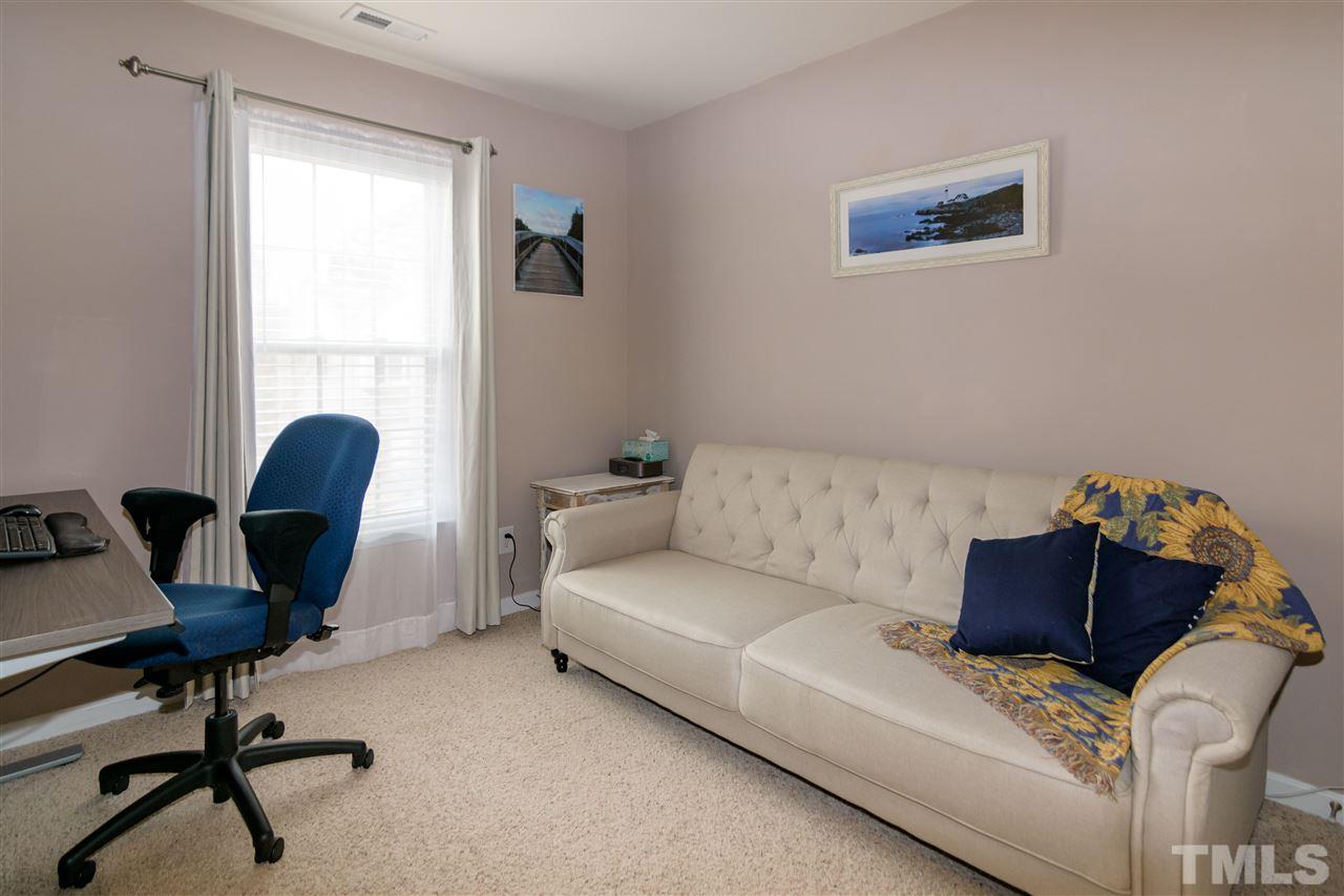 8630 Redcrest Place Raleigh, NC 27617 - Photo 18 of 24 a living room with furniture and a window
