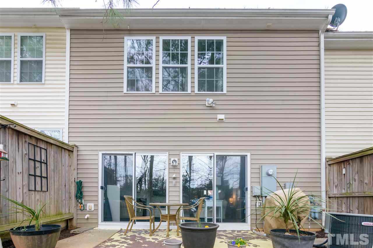 8630 Redcrest Place Raleigh, NC 27617 - Photo 20 of 24 a view of a building with a window and a glass door