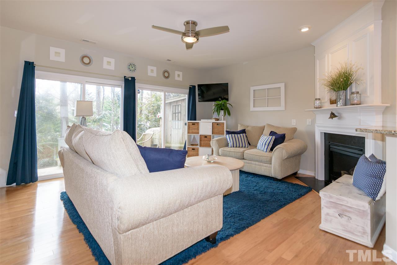 8630 Redcrest Place Raleigh, NC 27617 - Photo 8 of 24 a living room with fireplace furniture and a large window
