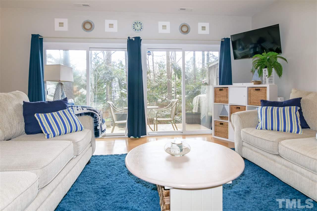 8630 Redcrest Place Raleigh, NC 27617 - Photo 10 of 24 a living room with furniture and a large window