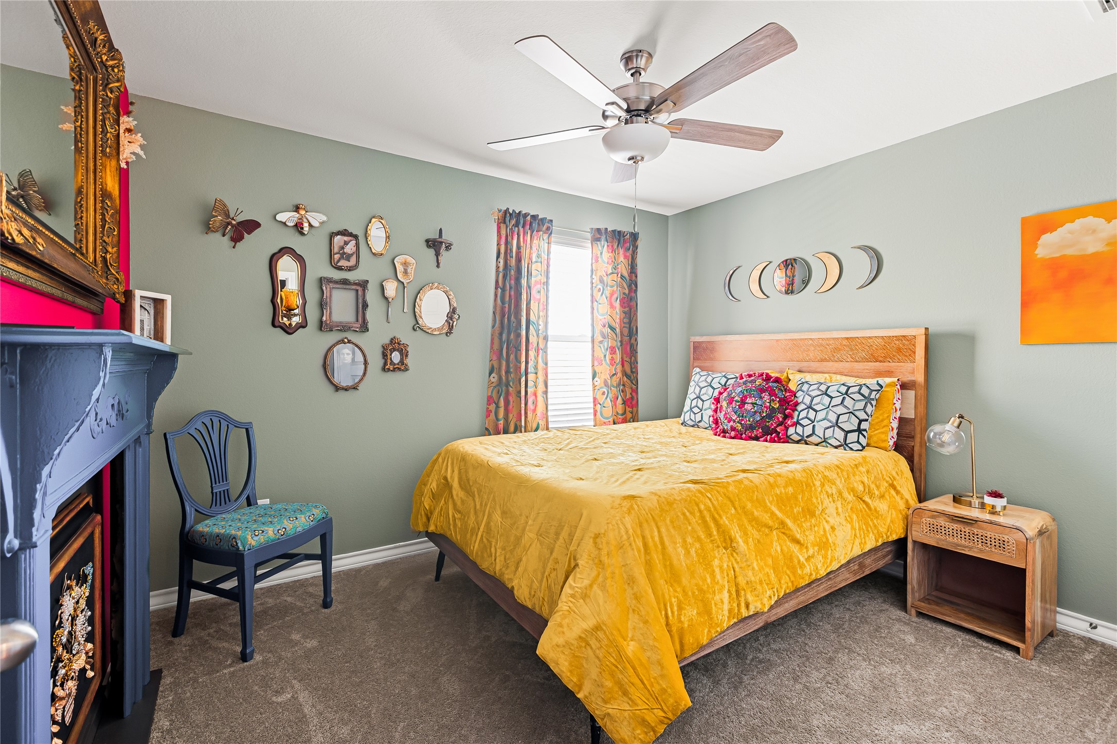 862 Pepperbark Loop Buda, TX 78610 - Photo 24 of 40 a bedroom with a bed and a chandelier