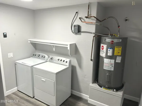 a utility room with dryer and washer