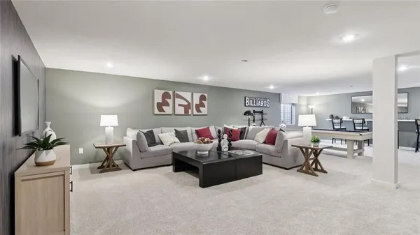 a view of a room with furniture and window