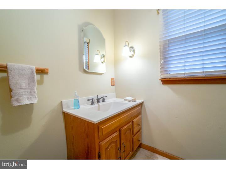 11 Foxchase Road Tabernacle, NJ 08088 - Photo 13 of 25 a bathroom with a sink mirror and vanity