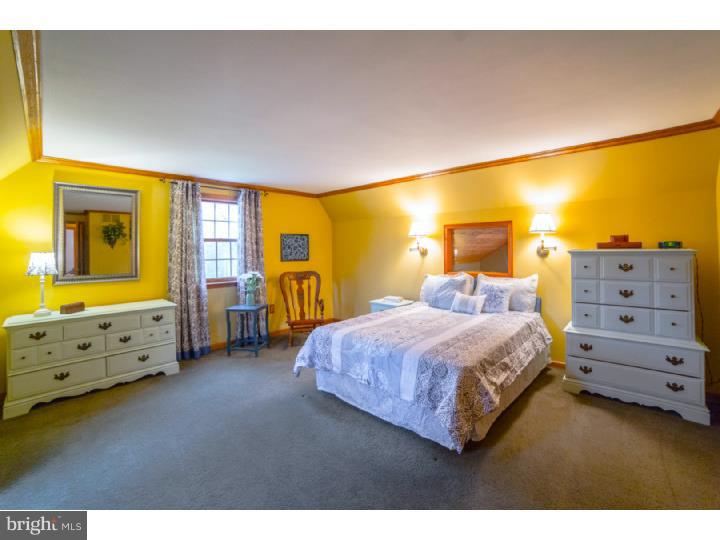 11 Foxchase Road Tabernacle, NJ 08088 - Photo 14 of 25 a bedroom with a bed and wooden floor