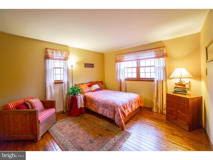 11 Foxchase Road Tabernacle, NJ 08088 - Photo 20 of 25 a bedroom with a bed and wooden floor