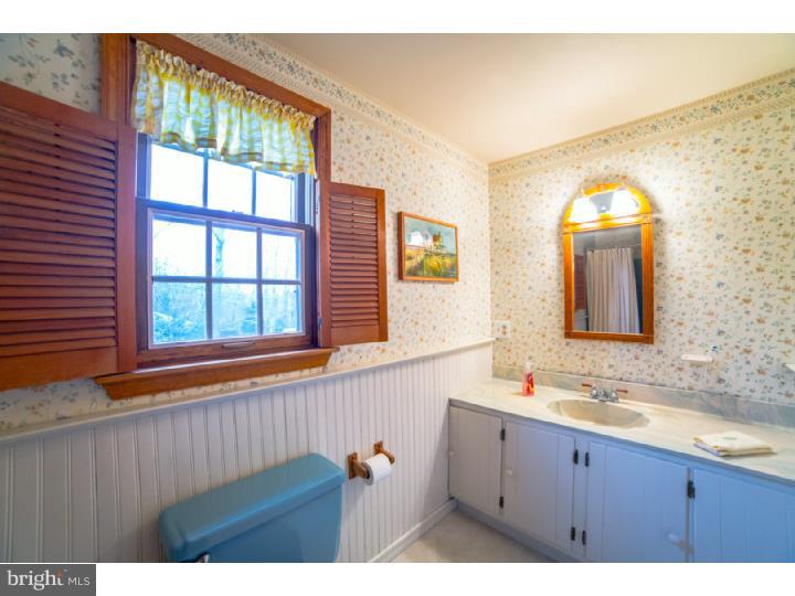 11 Foxchase Road Tabernacle, NJ 08088 - Photo 22 of 25 a bathroom with a sink mirror and a window